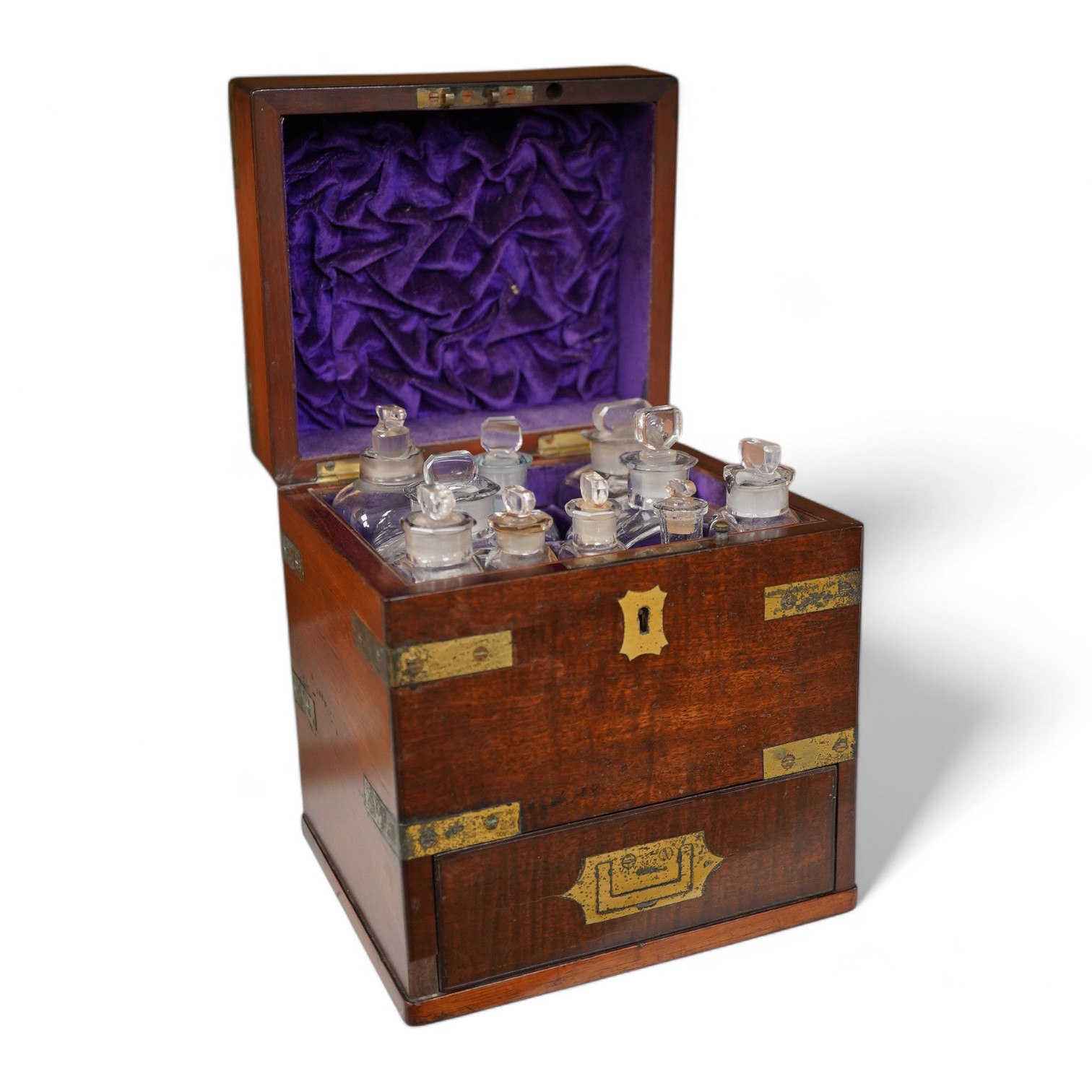 An early 19th century mahogany apothecary box, containing ten glass bottles, one with original paper label for the chemist Elam, 196 Oxford Street, London, with draw beneath containing a pair of scales, and weights, etc.